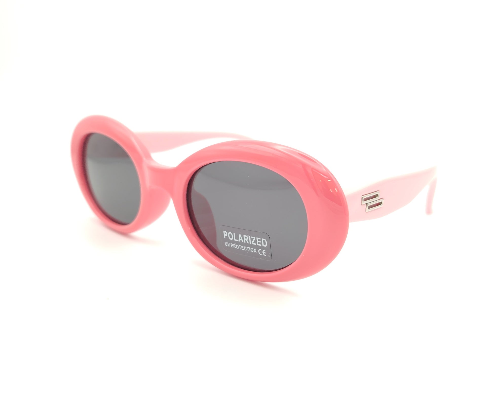 gafas de sol infantiles polarizadas con montura ovalada rosa y varillas en rosa claro y lentes grises con protección uv.