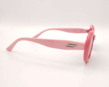 gafas de sol infantiles polarizadas con montura ovalada rosa y varillas en rosa claro y lentes grises con protección uv.