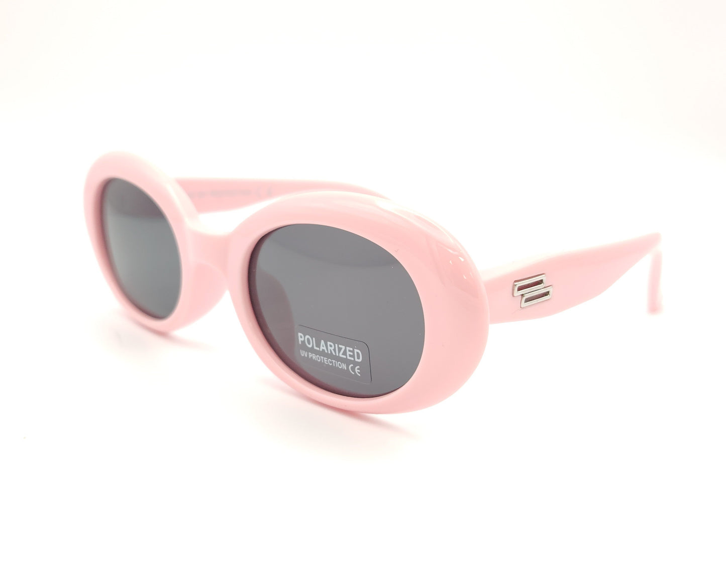 gafas de sol infantiles polarizadas con montura ovalada rosa pastel y lentes grises con protección uv.
