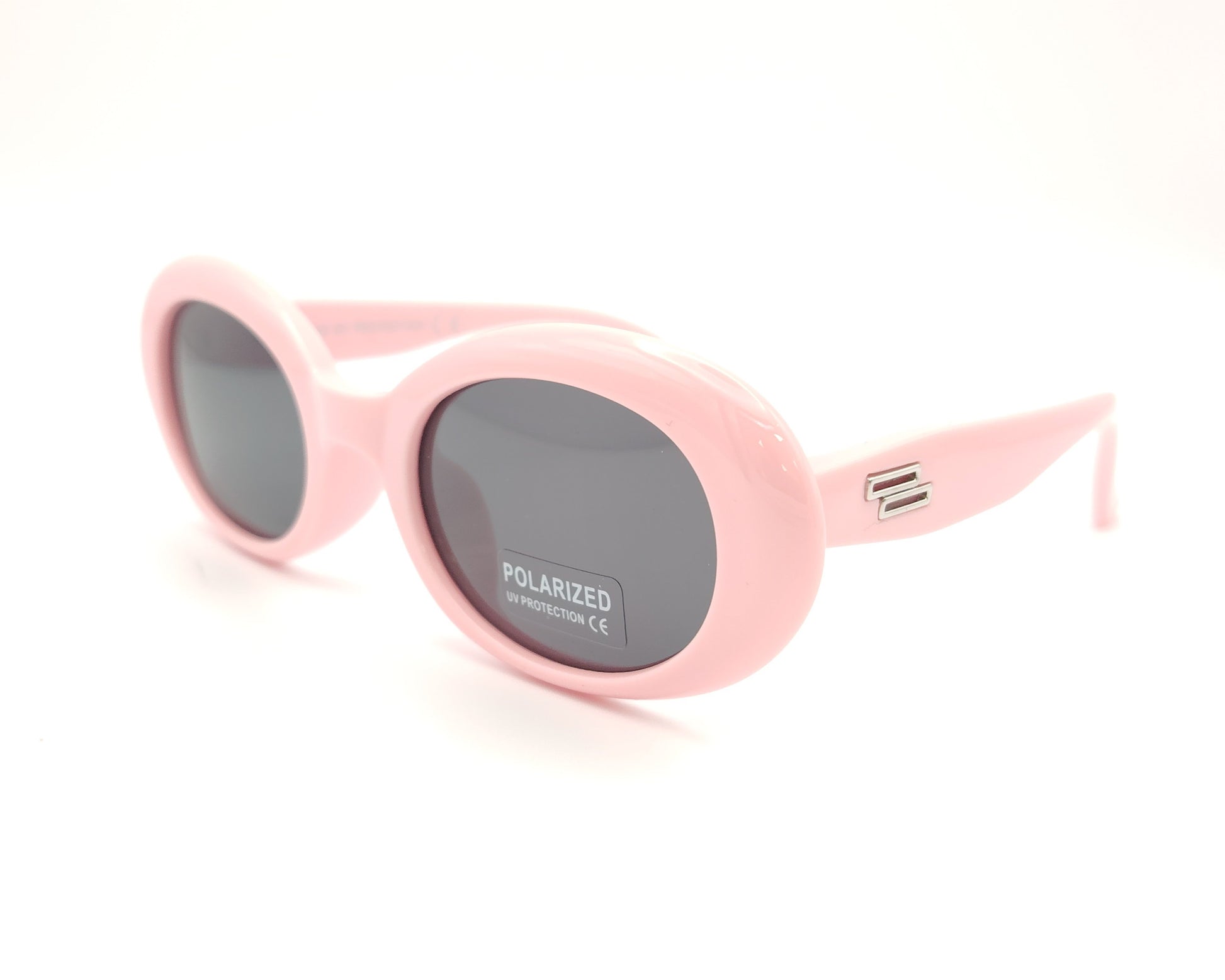 gafas de sol infantiles polarizadas con montura ovalada rosa pastel y lentes grises con protección uv.