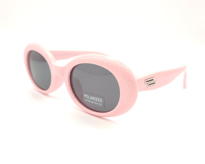 gafas de sol infantiles polarizadas con montura ovalada rosa pastel y lentes grises con protección uv.