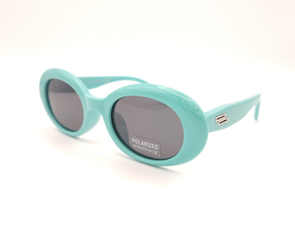 gafas de sol infantiles polarizadas con montura ovalada turquesa y lentes grises con protección uv.