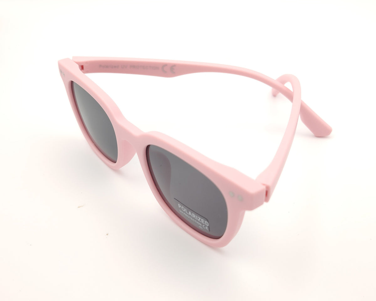 gafas de sol infantiles polarizadas con montura rosa pastel mate y lentes grises con protección uv