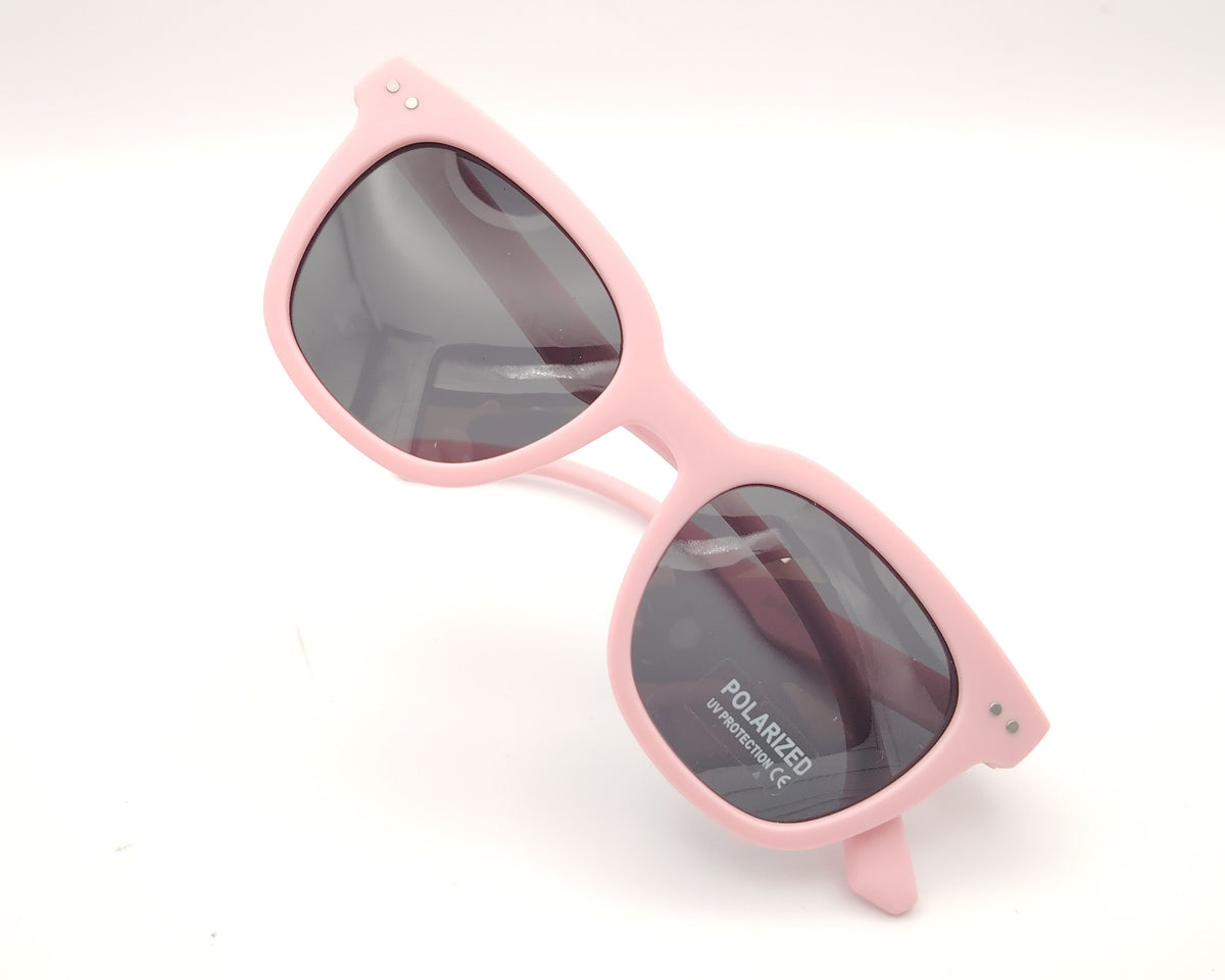 gafas de sol infantiles polarizadas con montura rosa pastel mate y lentes grises con protección uv
