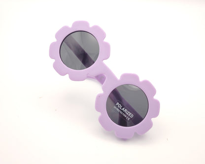 gafas de sol infantiles polarizadas con montura lila en forma de flor y lentes grises con protección UV