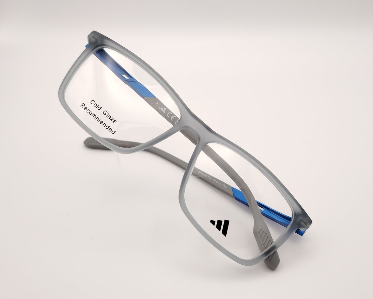 adidas sp5070 020 gafas graduadas de forma rectangular con montura en gris translúcido y detalles en azul diseño ligero