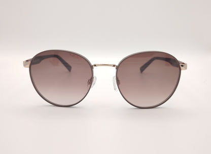 gafas de sol redondas con montura marrón y detalles dorados en los talones