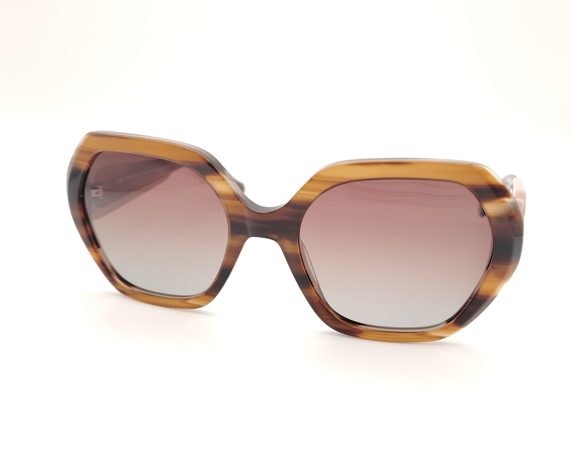 gafas de sol polarizadas oversize veteadas en tonos marrón miel con varillas color maquillaje