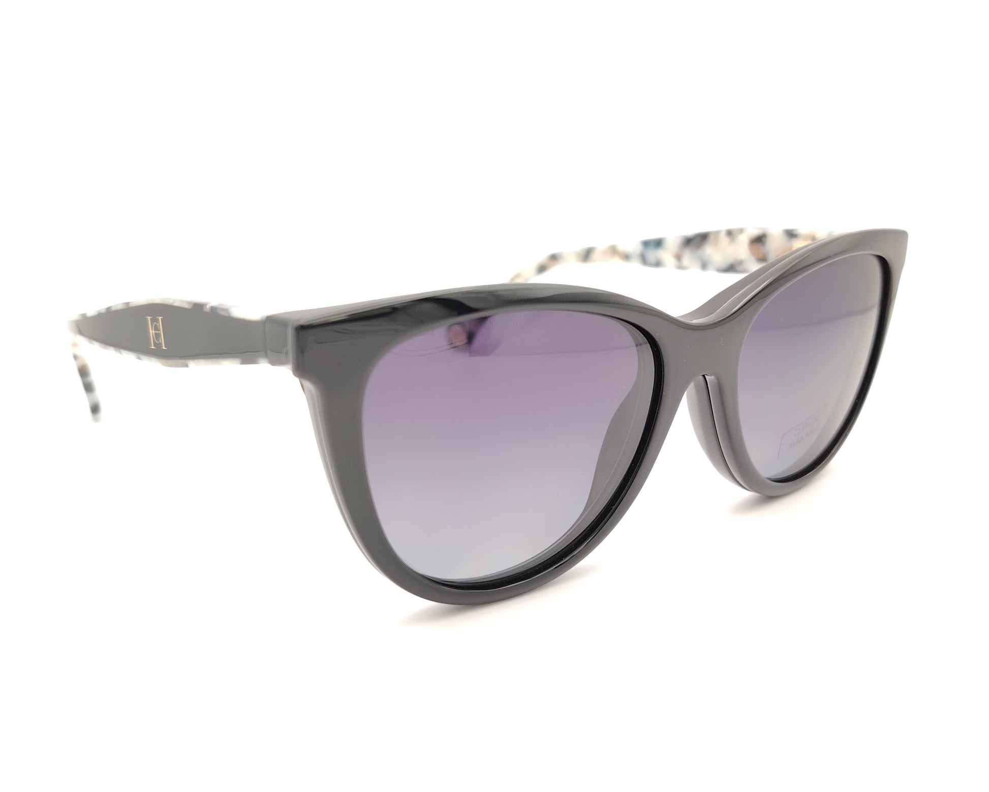 gafas carolina herrera negras con varillas moteadas y clip-on solar con lentes oscuras