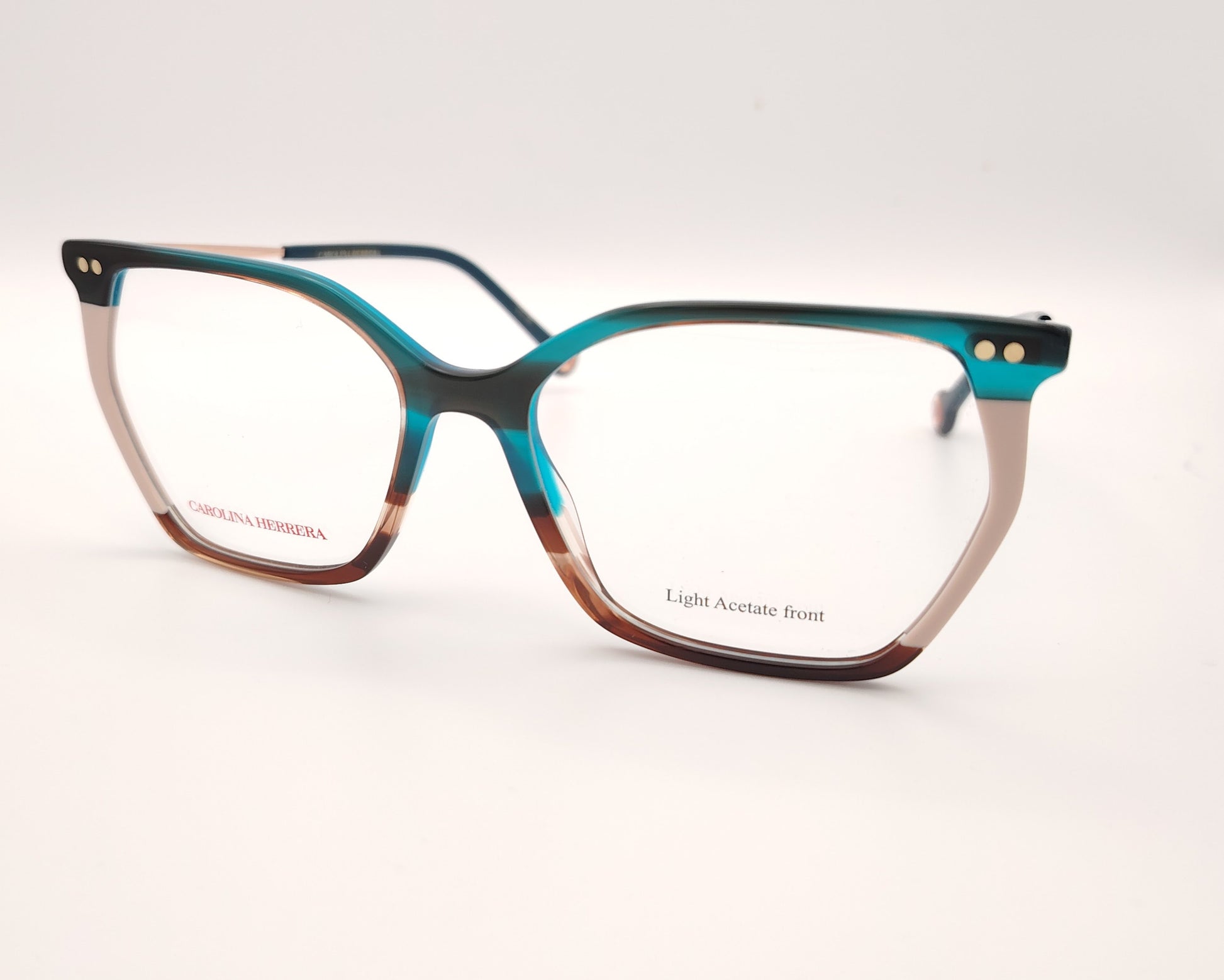 gafas graduadas carolina herrera de acetato fino en azul turquesa, beige y carey con varillas metálicas doradas