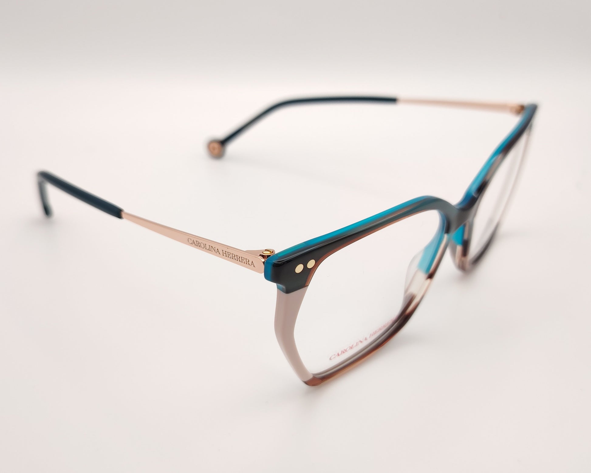 gafas graduadas carolina herrera de acetato fino en azul turquesa, rosa claro y carey con varillas metálicas doradas