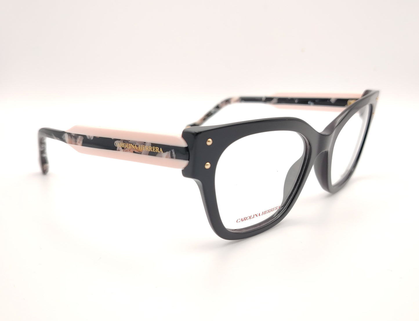 gafas graduadas carolina herrera de forma cuadrada en negro con varillas rosa claro y detalles marmolados
