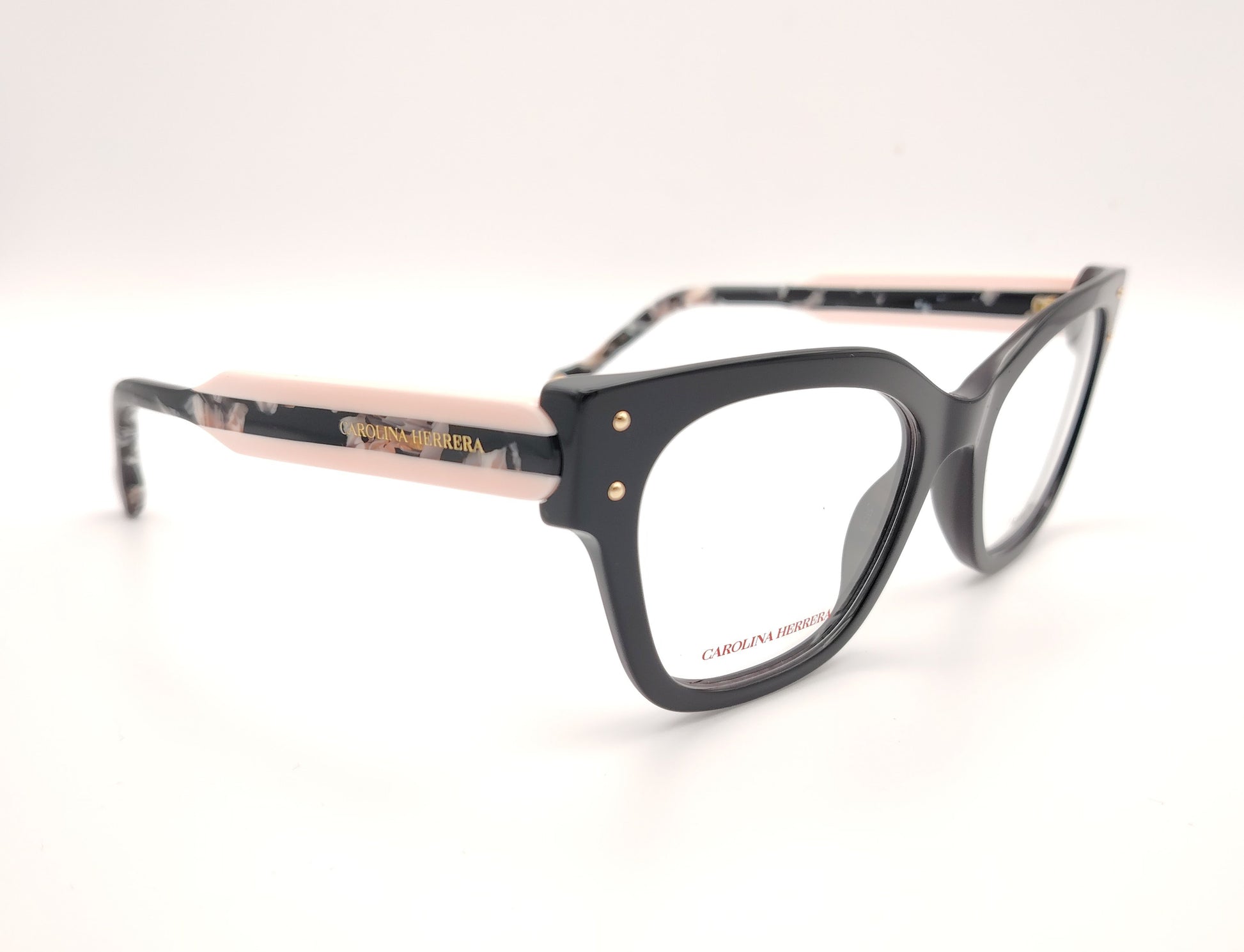 gafas graduadas carolina herrera de forma cuadrada en negro con varillas rosa claro y detalles marmolados