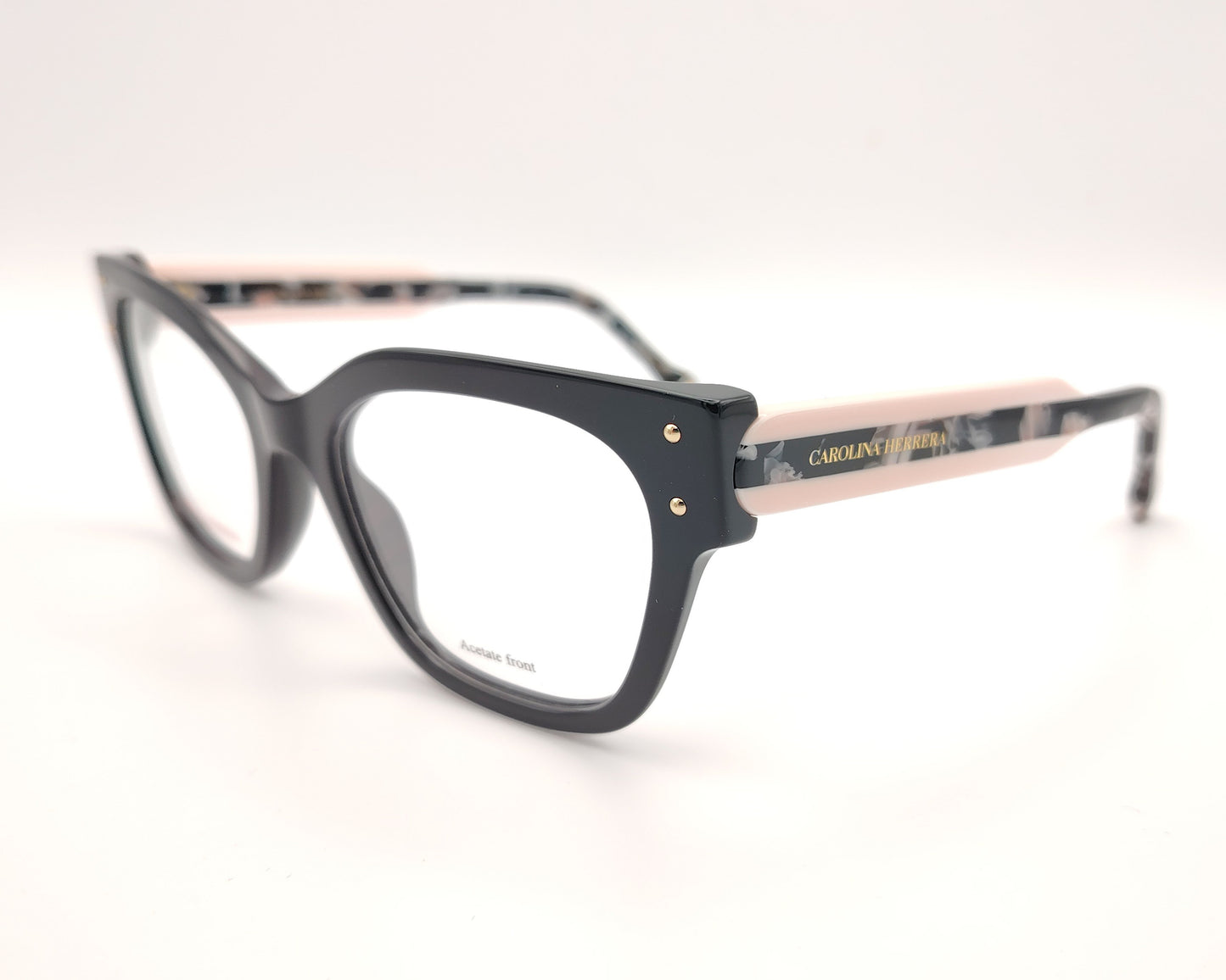 gafas graduadas carolina herrera de forma cuadrada en negro con varillas rosa claro y detalles marmolados