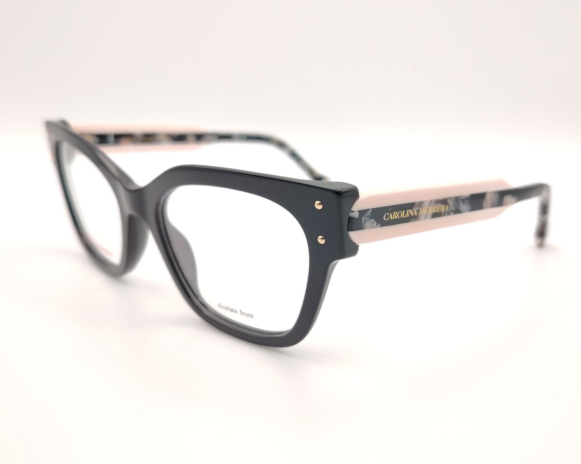gafas graduadas carolina herrera de forma cuadrada en negro con varillas rosa claro y detalles marmolados