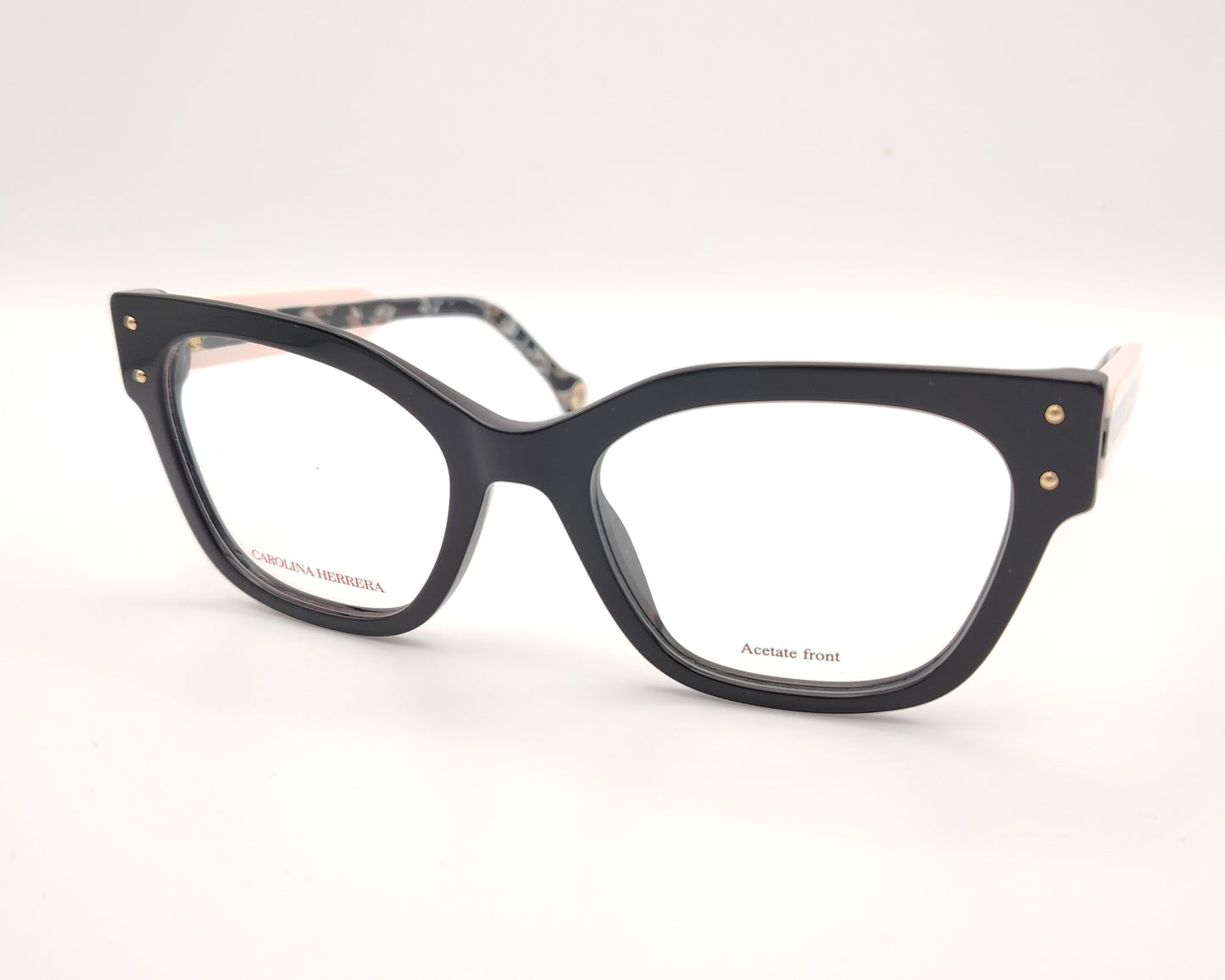 gafas graduadas carolina herrera de forma cuadrada en negro con varillas rosa claro y detalles marmolados