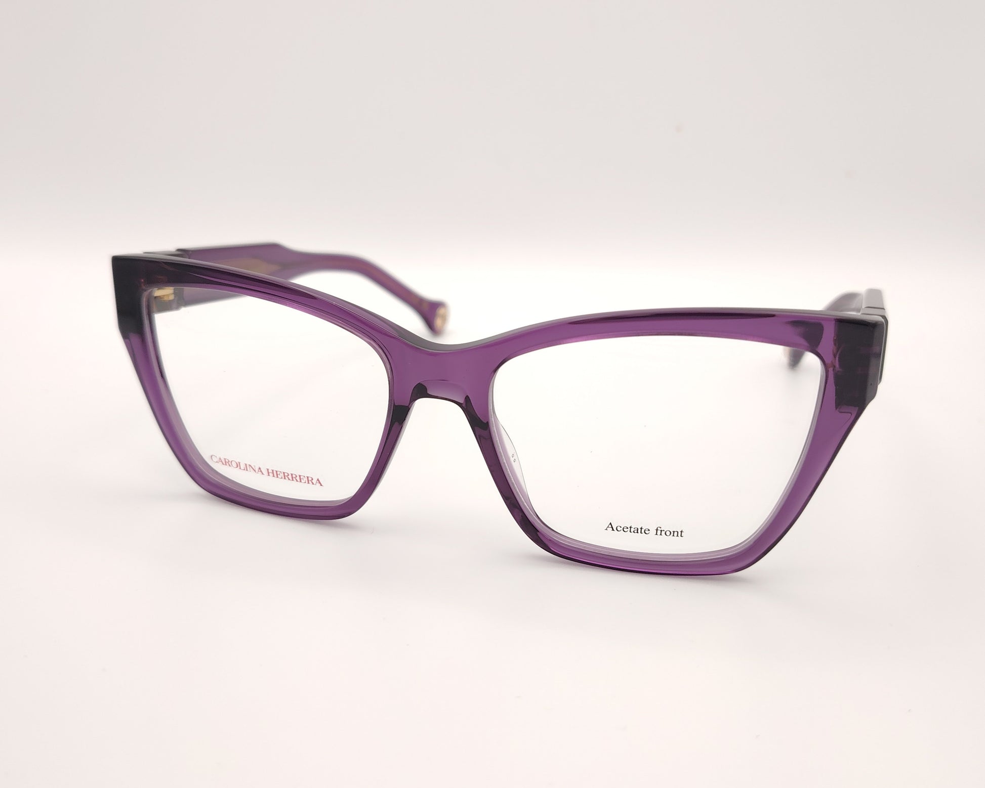 gafas graduadas carolina herrera de forma cuadrada en acetato translúcido morado con detalle dorado en las varillas