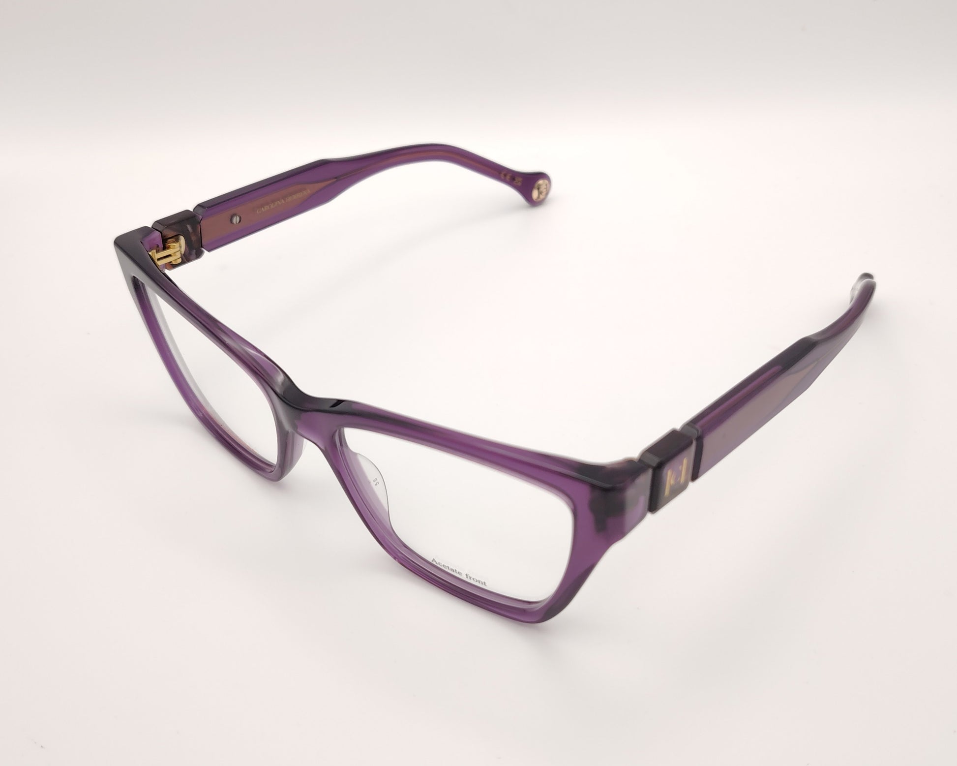 gafas graduadas carolina herrera de forma cuadrada en acetato translúcido morado con detalle dorado en las varillas