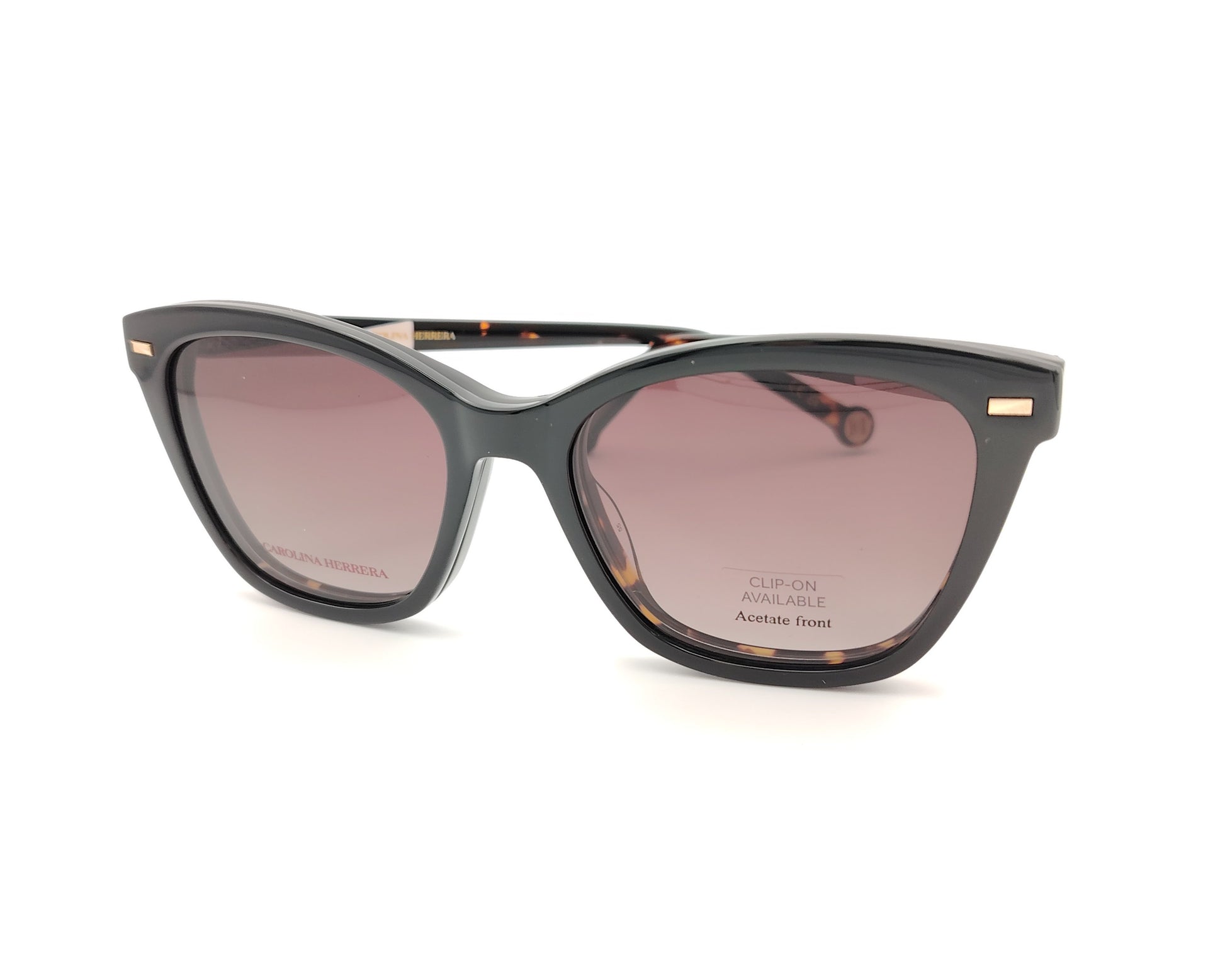 gafas graduadas carolina herrera de forma cat eye en carey oscuro con varillas negro y rosa claro y clip on solar