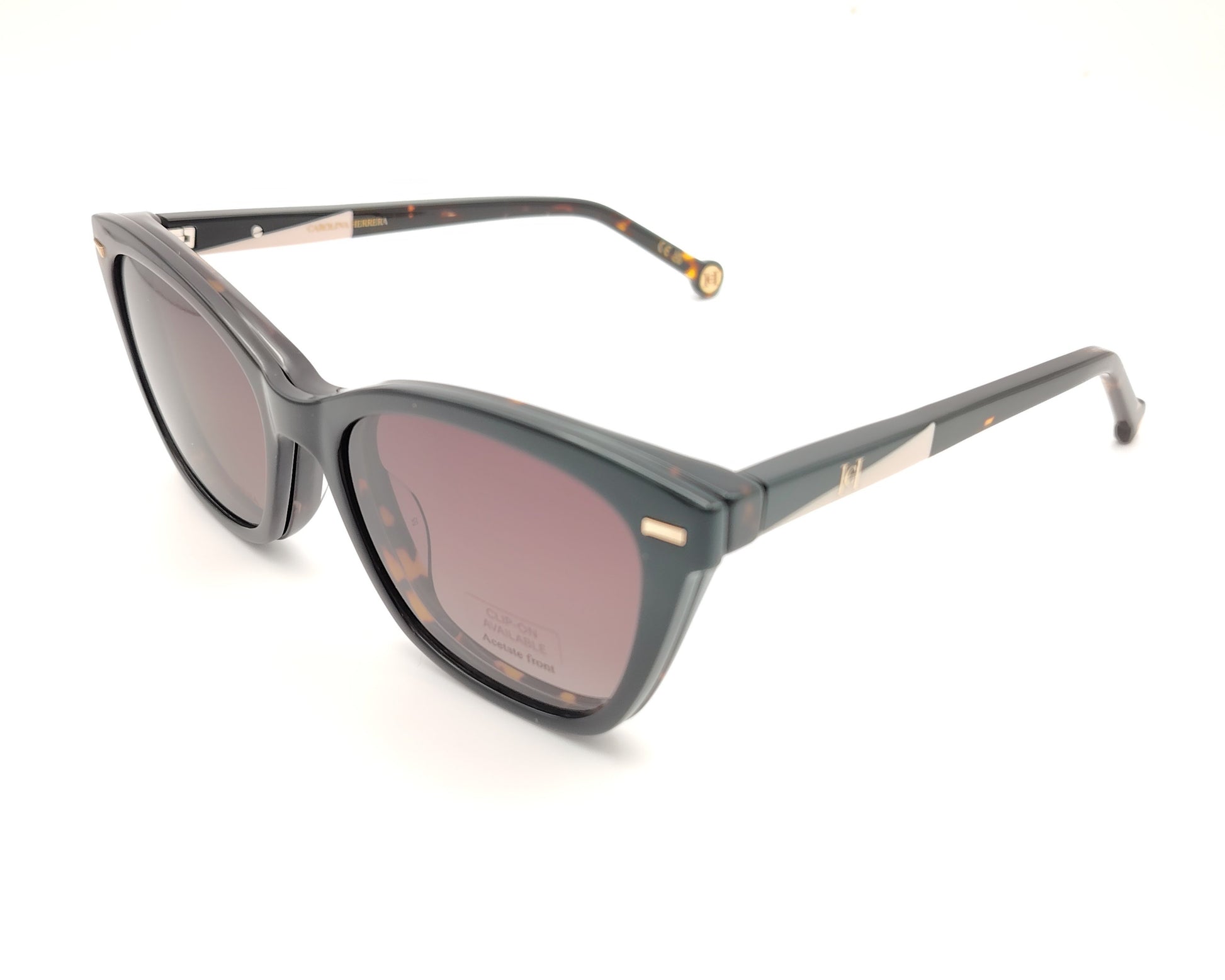 gafas graduadas carolina herrera de forma cat eye en carey oscuro con varillas negro y rosa claro y clip on solar