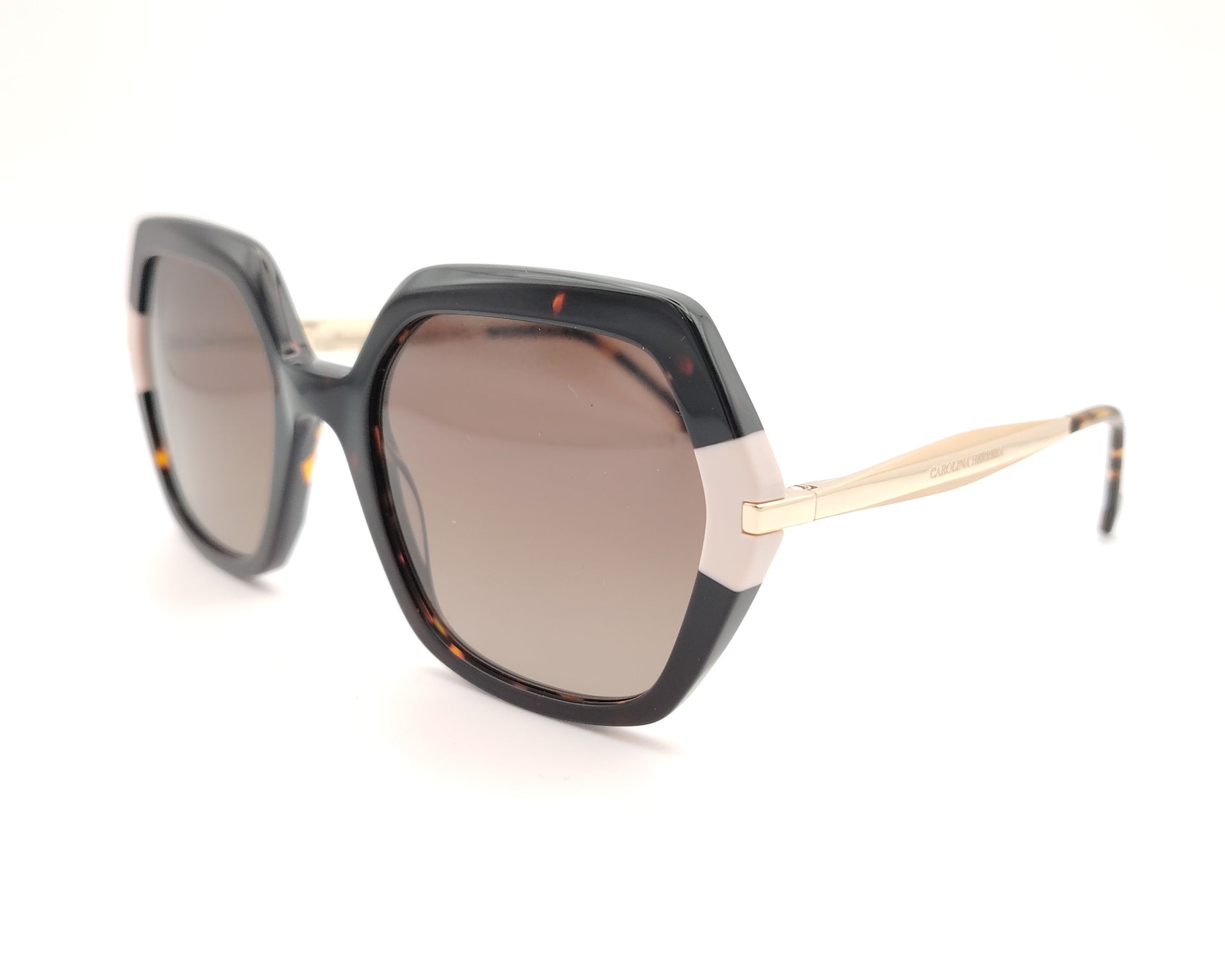 gafas de sol carolina herrera oversize geométricas carey con detalles nude y varillas doradas