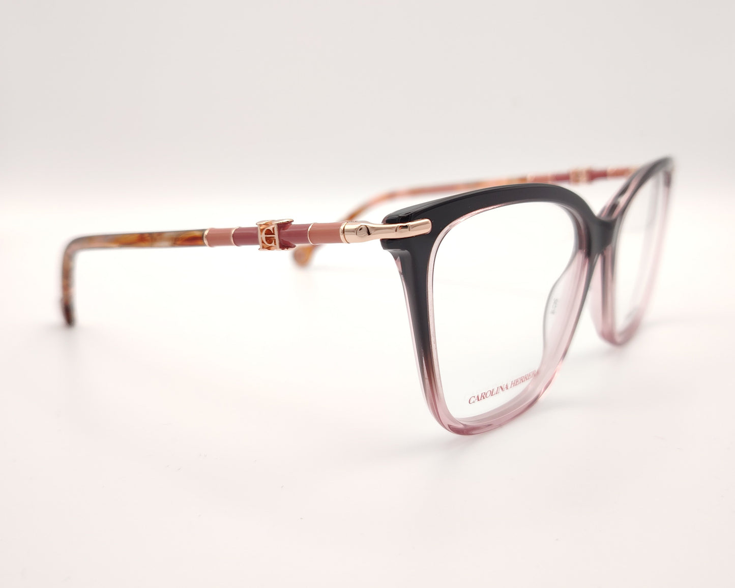gafas carolina herrera  con degradado de berenjena a rosa y varillas finas doradas con detalles  rosados y carey 