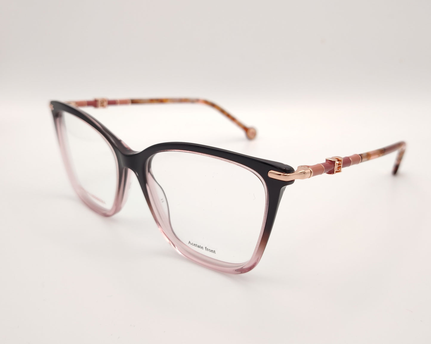 gafas carolina herrera  con degradado de berenjena a rosa y varillas finas doradas con detalles carey 