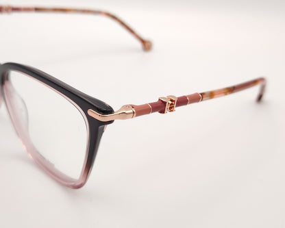 gafas carolina herrera  con degradado de berenjena a rosa y varillas finas doradas con detalles carey 