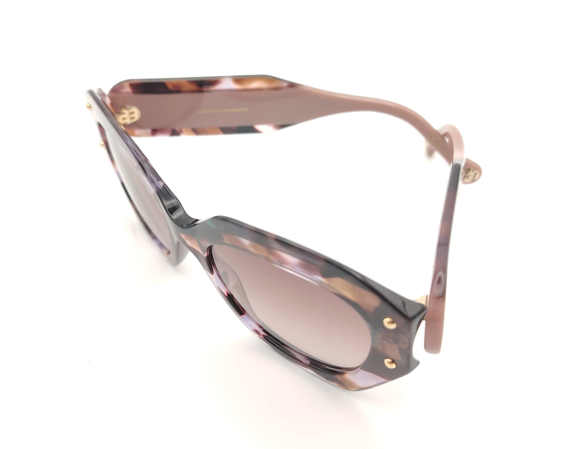 gafas de sol carolina herrera marmoladas en tonos rosa malva y carey con forma oversize