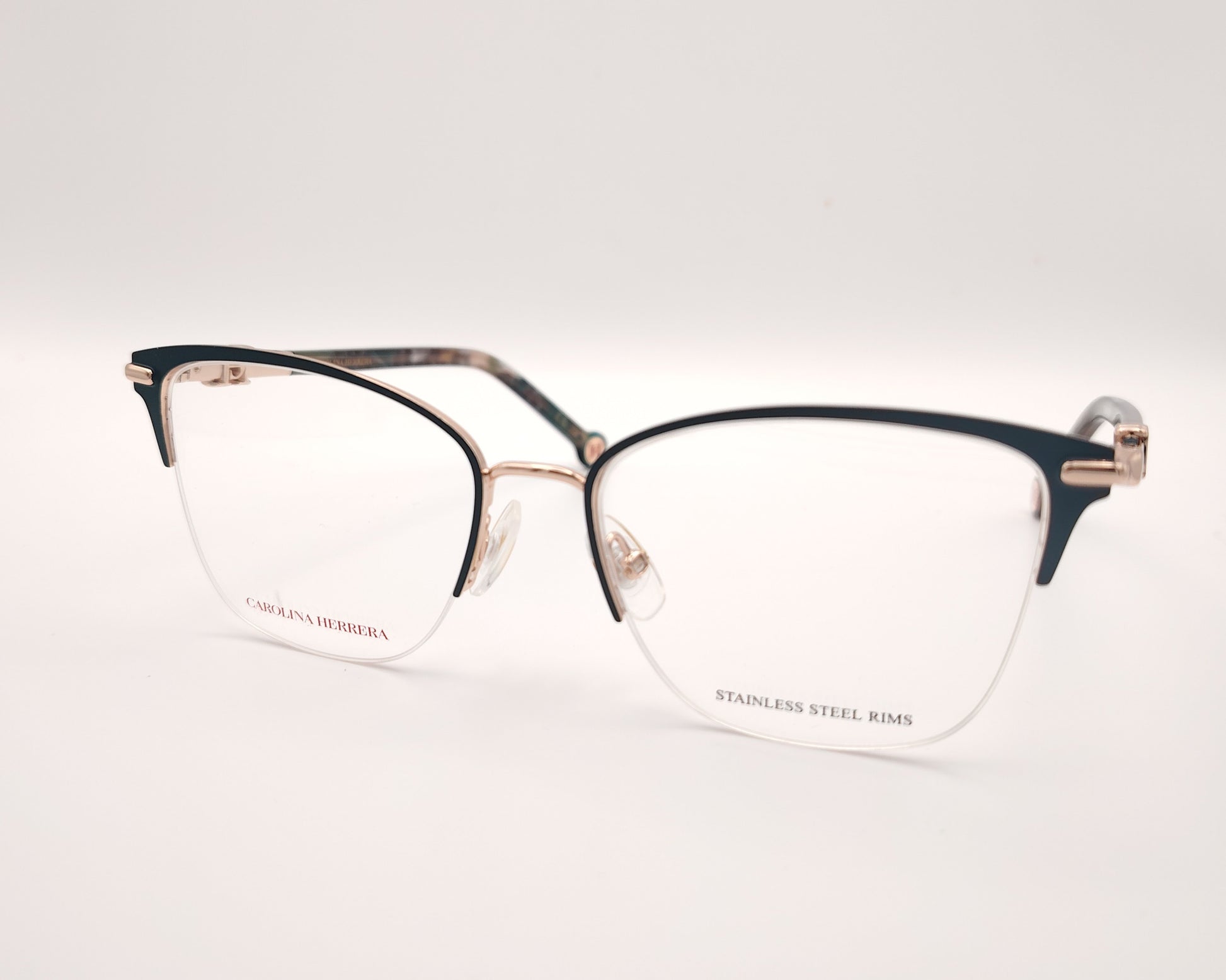 gafas de metal semi al aire carolina herrera en color verde y dorado