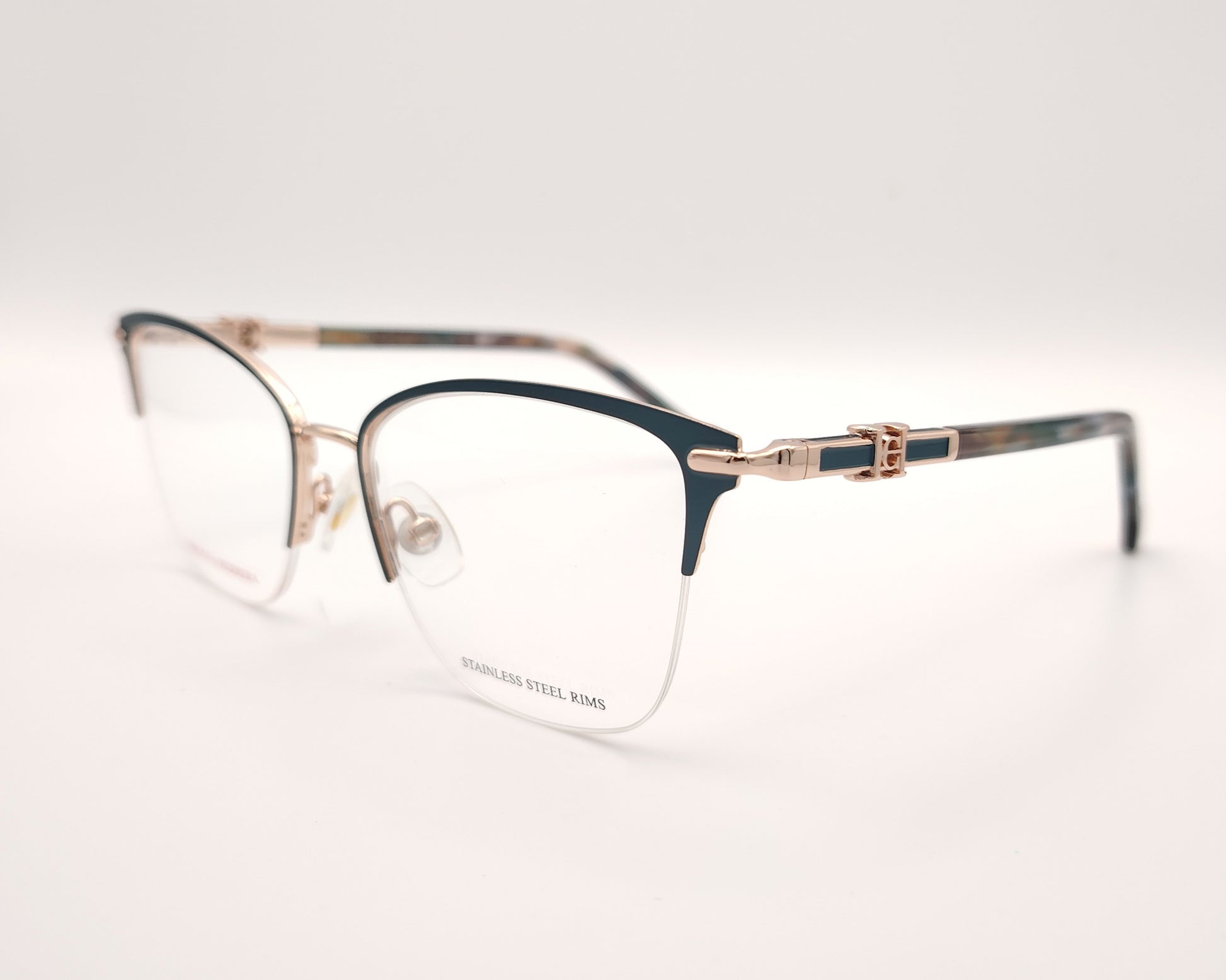 gafas de metal semi al aire carolina herrera en color verde y dorado