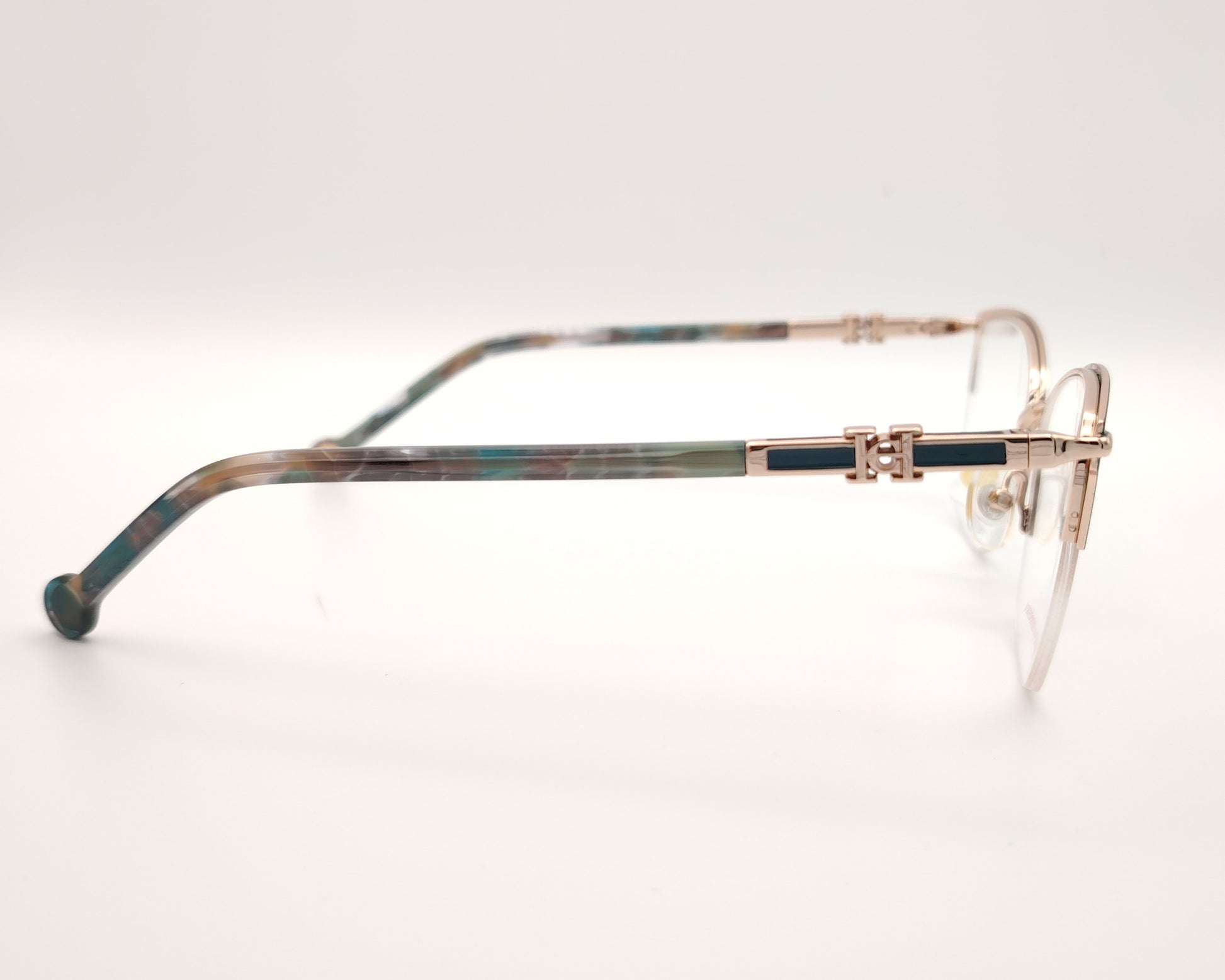 gafas de metal semi al aire carolina herrera en color verde y dorado
