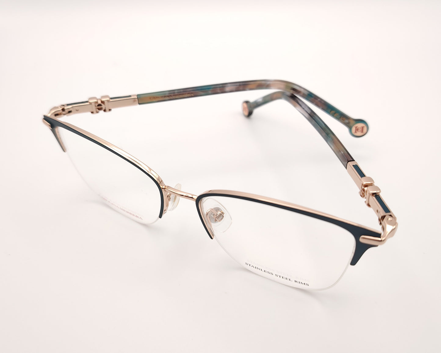 gafas de metal semi al aire carolina herrera en color verde y dorado