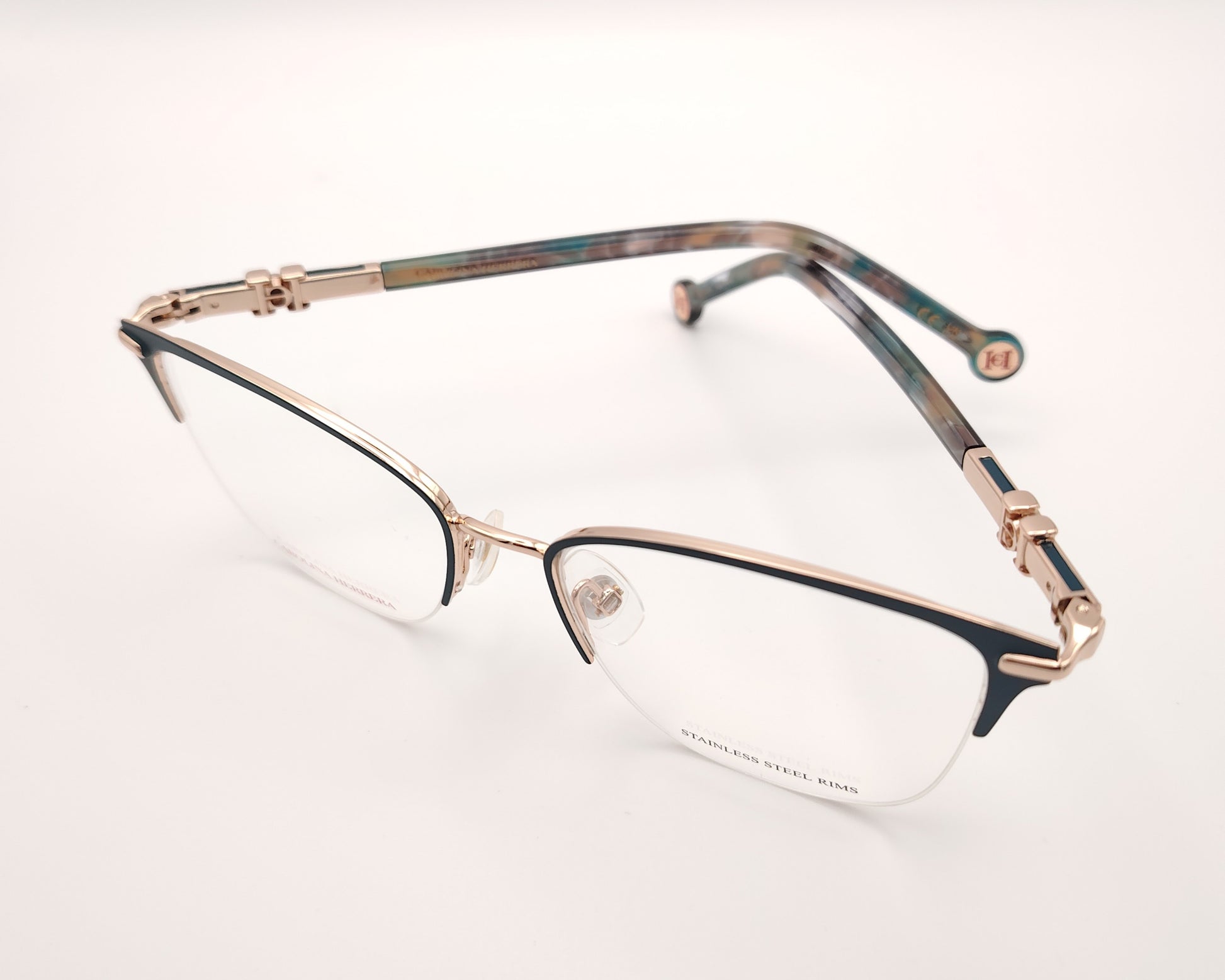 gafas de metal semi al aire carolina herrera en color verde y dorado