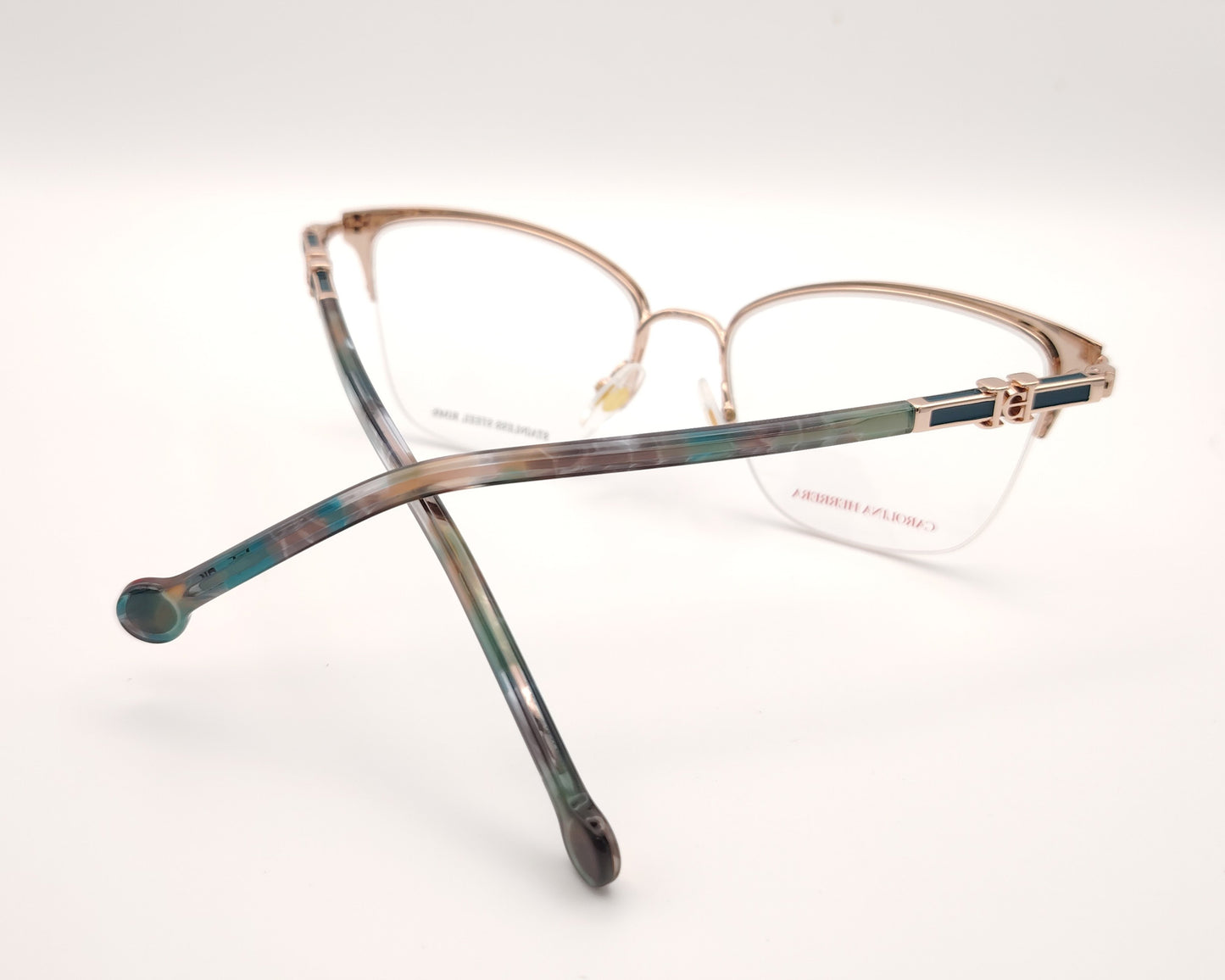 gafas de metal semi al aire carolina herrera en color verde y dorado