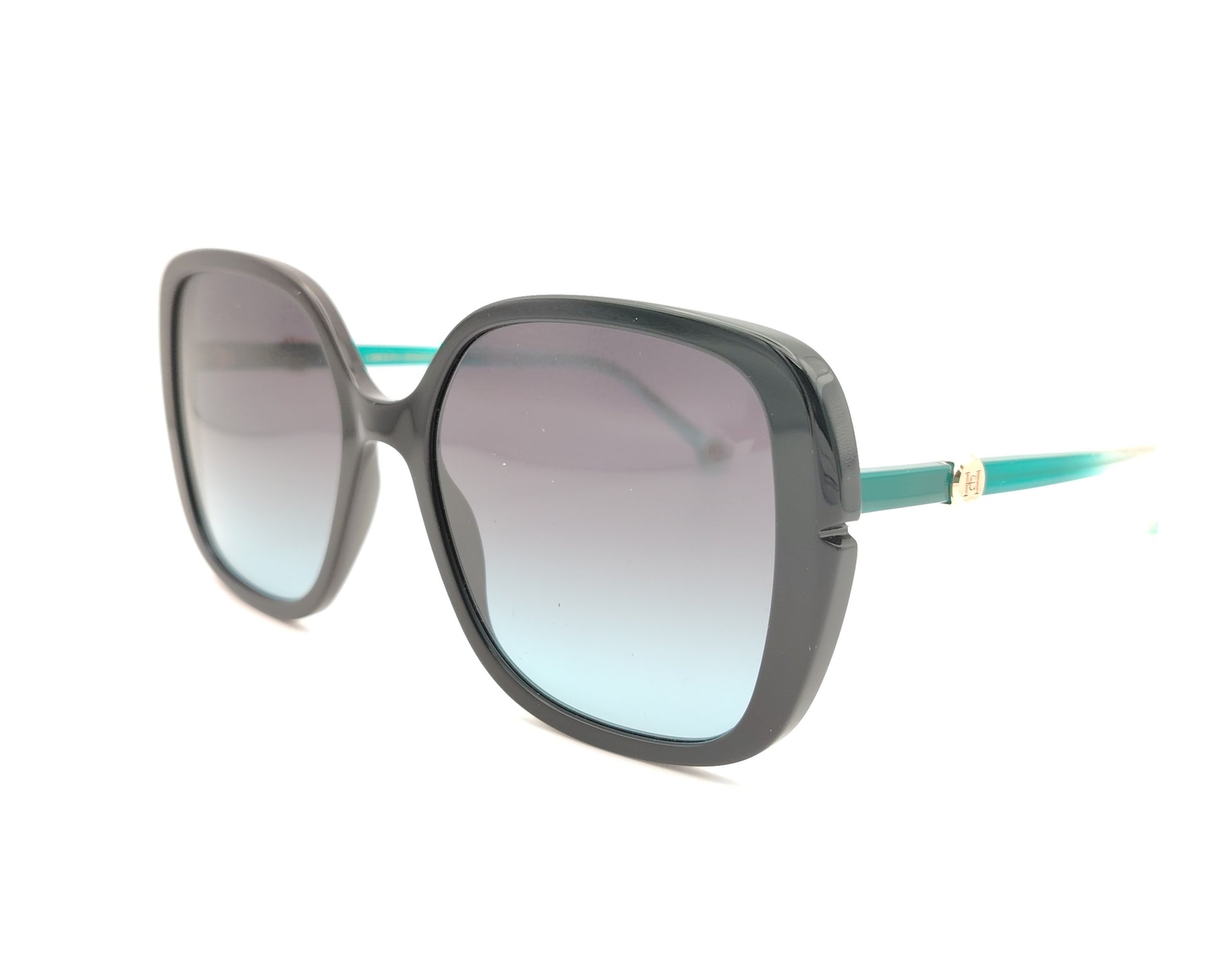 gafas de sol carolina herrera oversize negras con lentes degradadas y varillas turquesa