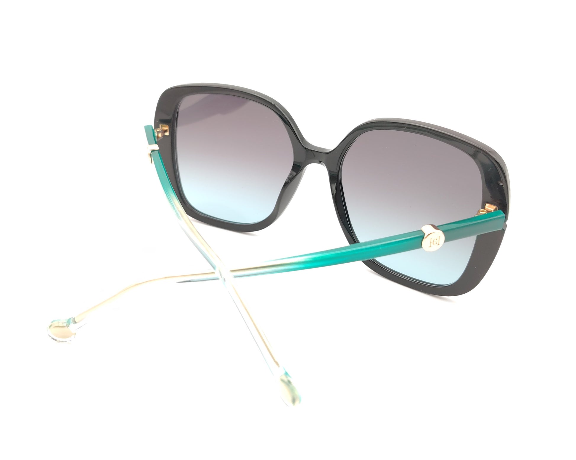gafas de sol carolina herrera oversize negras con lentes degradadas y varillas turquesa