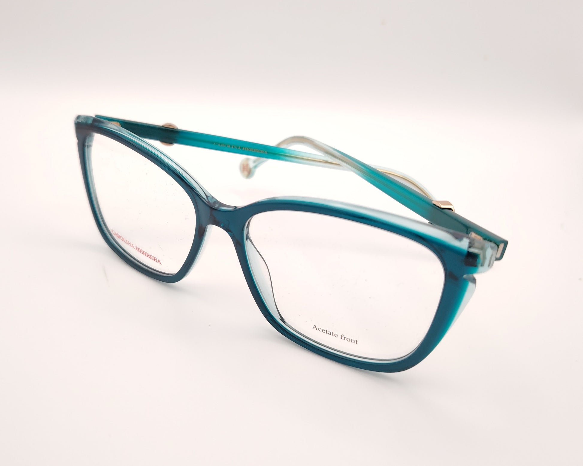 gafas graduadas carolina herrera azul petróleo translúcidas con forma cat eye  suave y detalle dorado