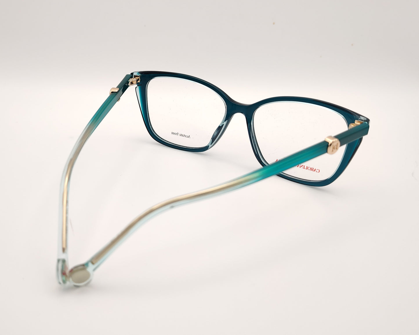 gafas graduadas carolina herrera azul petróleo translúcidas con forma cat eye  suave y detalle dorado
