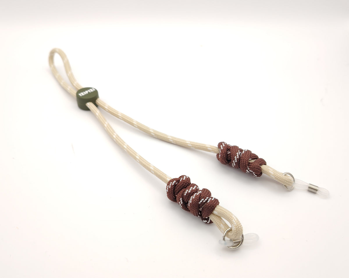 cordones para gafas infantiles de color beige y marrón con nudos suaves y ajuste adaptable
