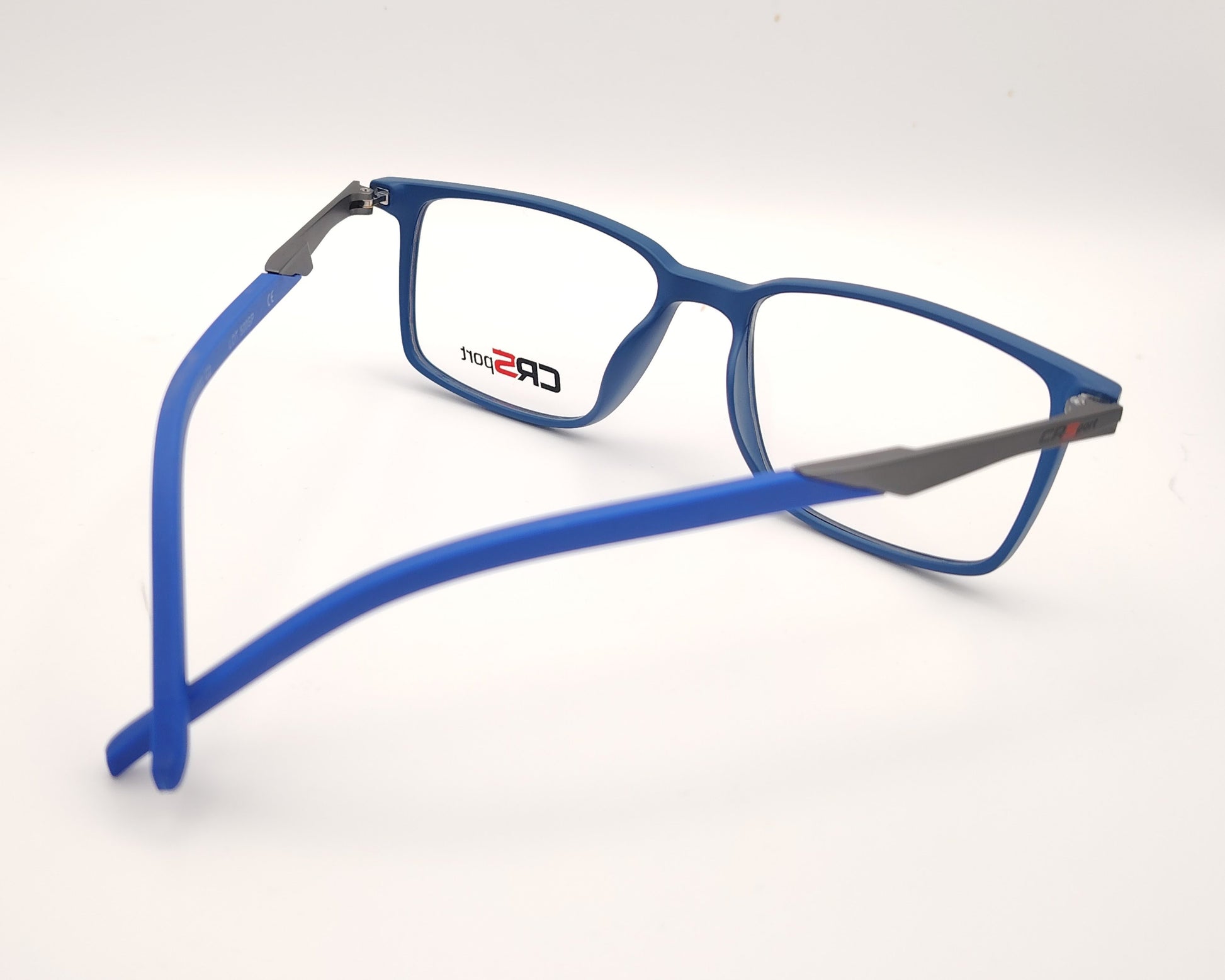 gafas graduadas rectangulares azul translúcido mate con varillas grises estilo deportivo