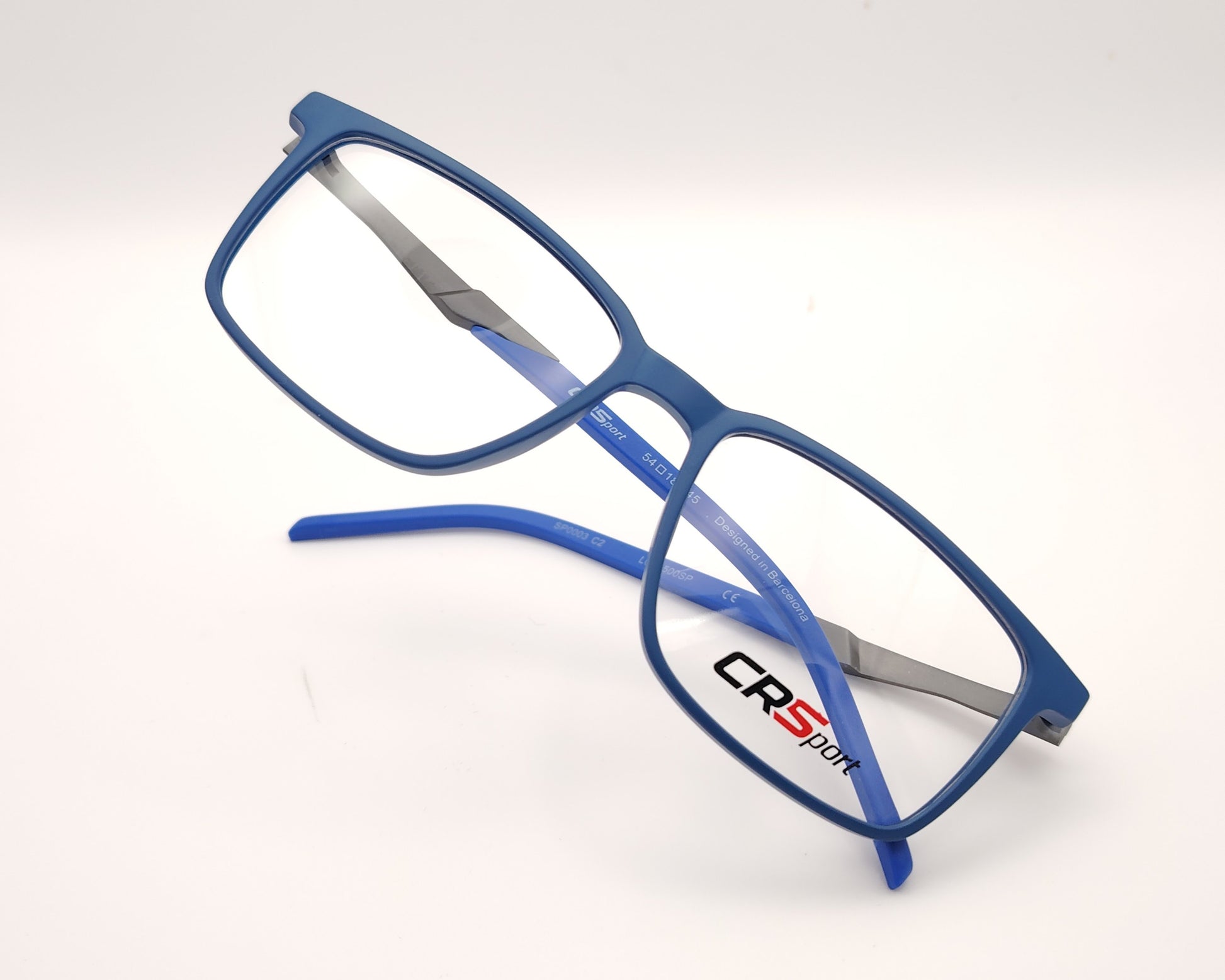gafas graduadas rectangulares azul translúcido mate con varillas grises estilo deportivo