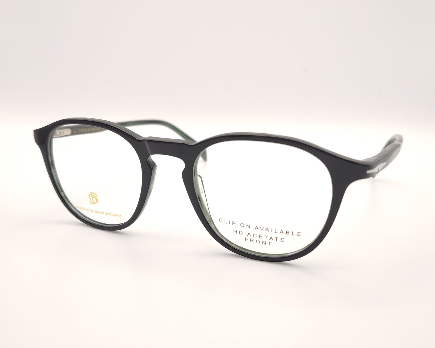 gafas graduadas de montura redondeada oscura con clip solar polarizado desmontable