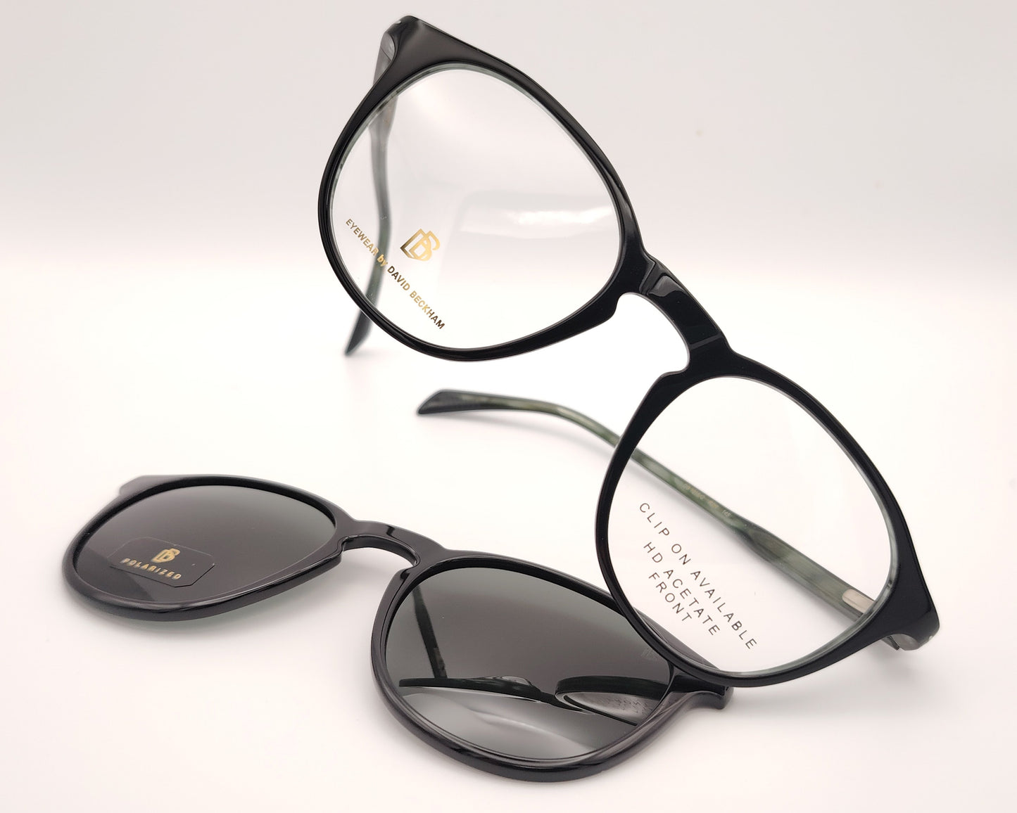 gafas graduadas de montura redondeada oscura con clip solar polarizado desmontable