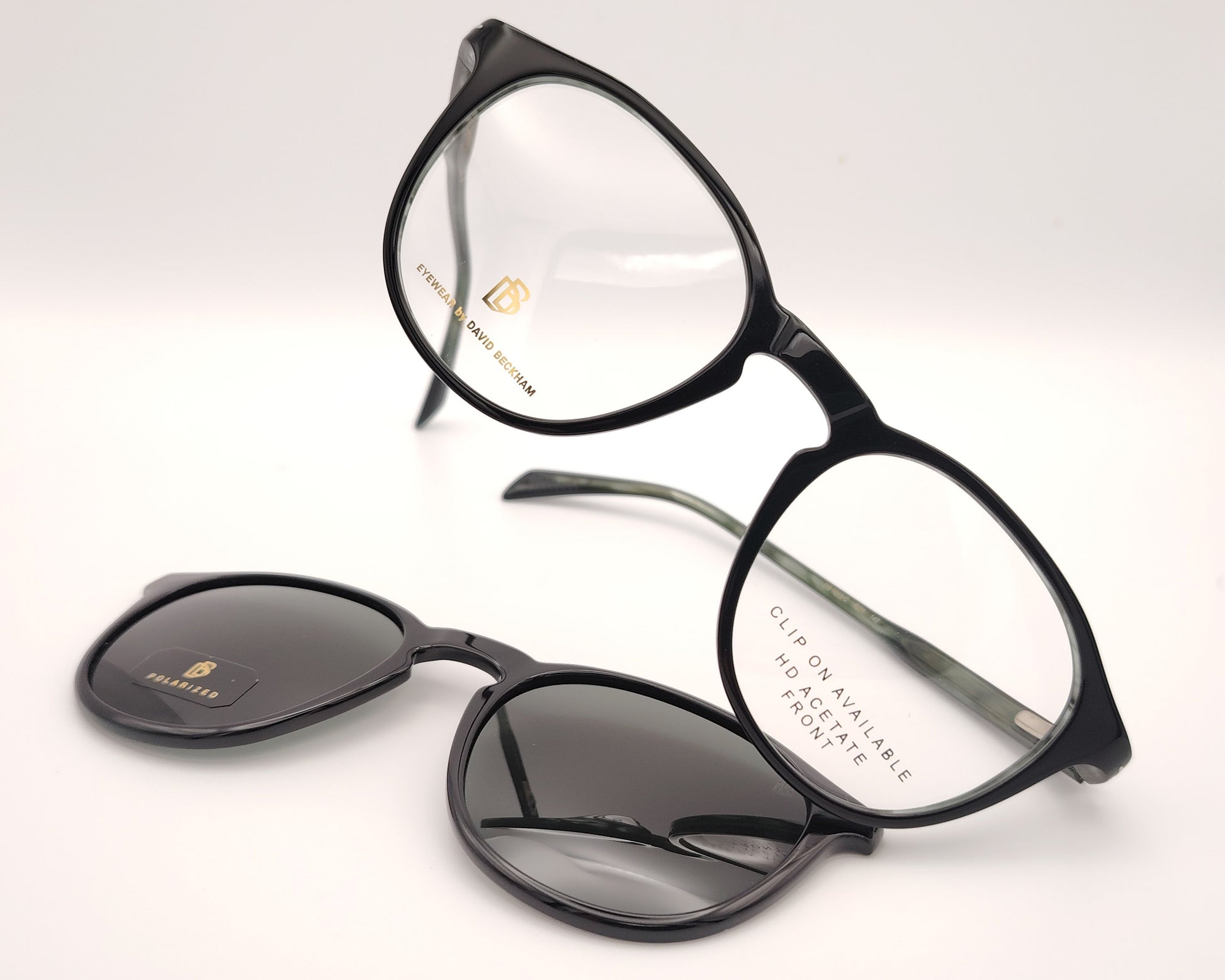 gafas graduadas de montura redondeada oscura con clip solar polarizado desmontable