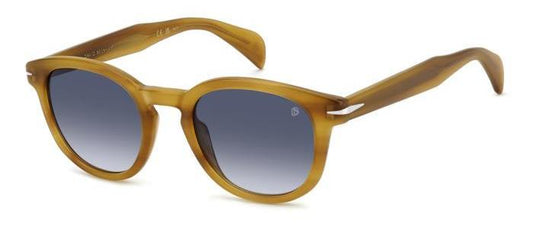 gafas de sol con montura translúcida color miel y lentes degradadas azules de forma redondeada