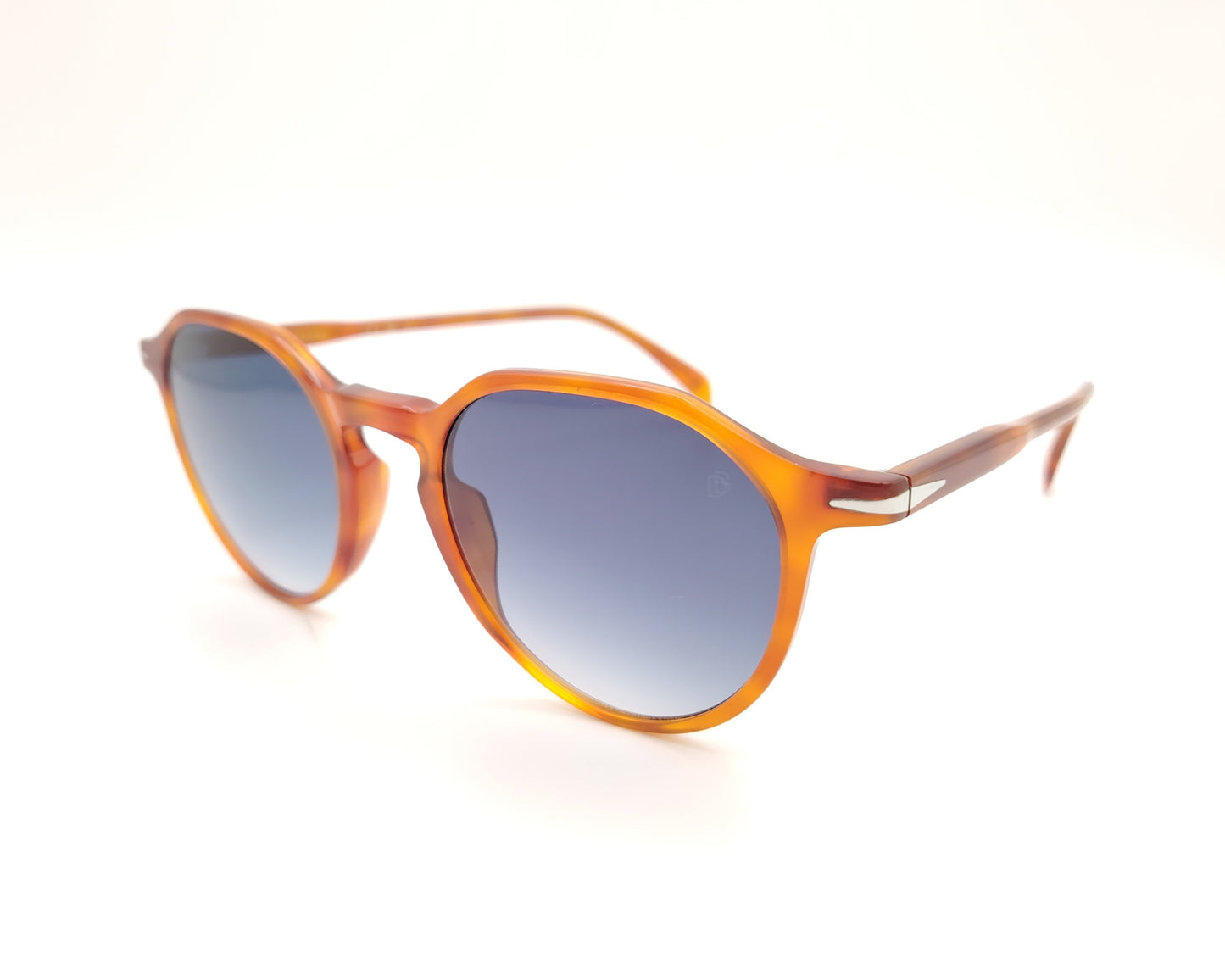 gafas de sol con montura translúcida color ámbar y lentes degradadas azules de forma redondeada