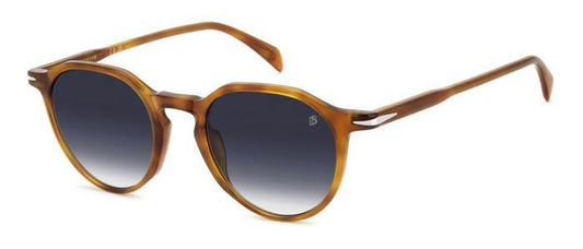 gafas de sol con montura translúcida color ámbar y lentes degradadas azules de forma redondeada