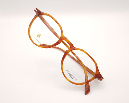 gafas graduadas redondas de acetato color miel con detalle metálico en las varillas