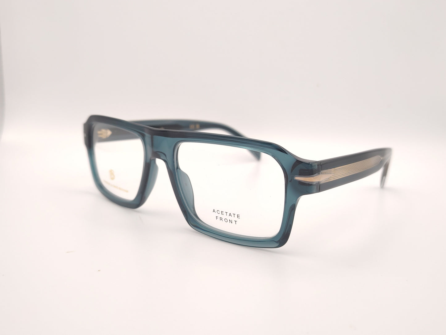 gafas graduadas rectangulares de acetato azul petróleo translúcido con detalle metálico en las varillas